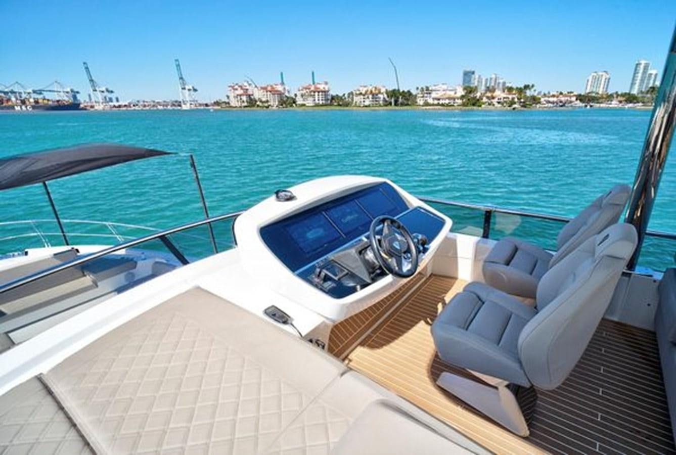 a boat on the water aboard 2021 FAIRLINE SQUADRON 68 Yacht for Sale