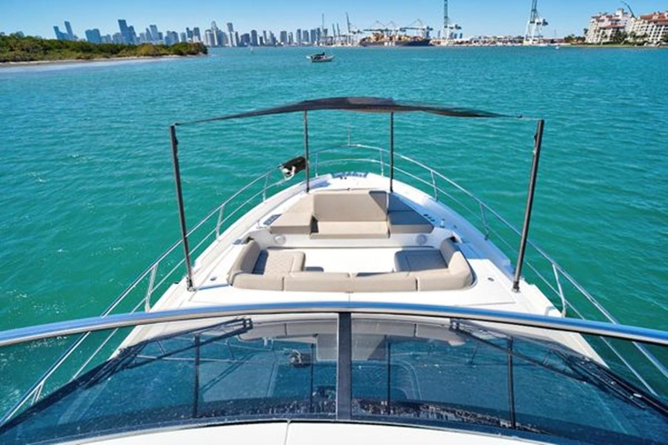 a boat on the water aboard 2021 FAIRLINE SQUADRON 68 Yacht for Sale