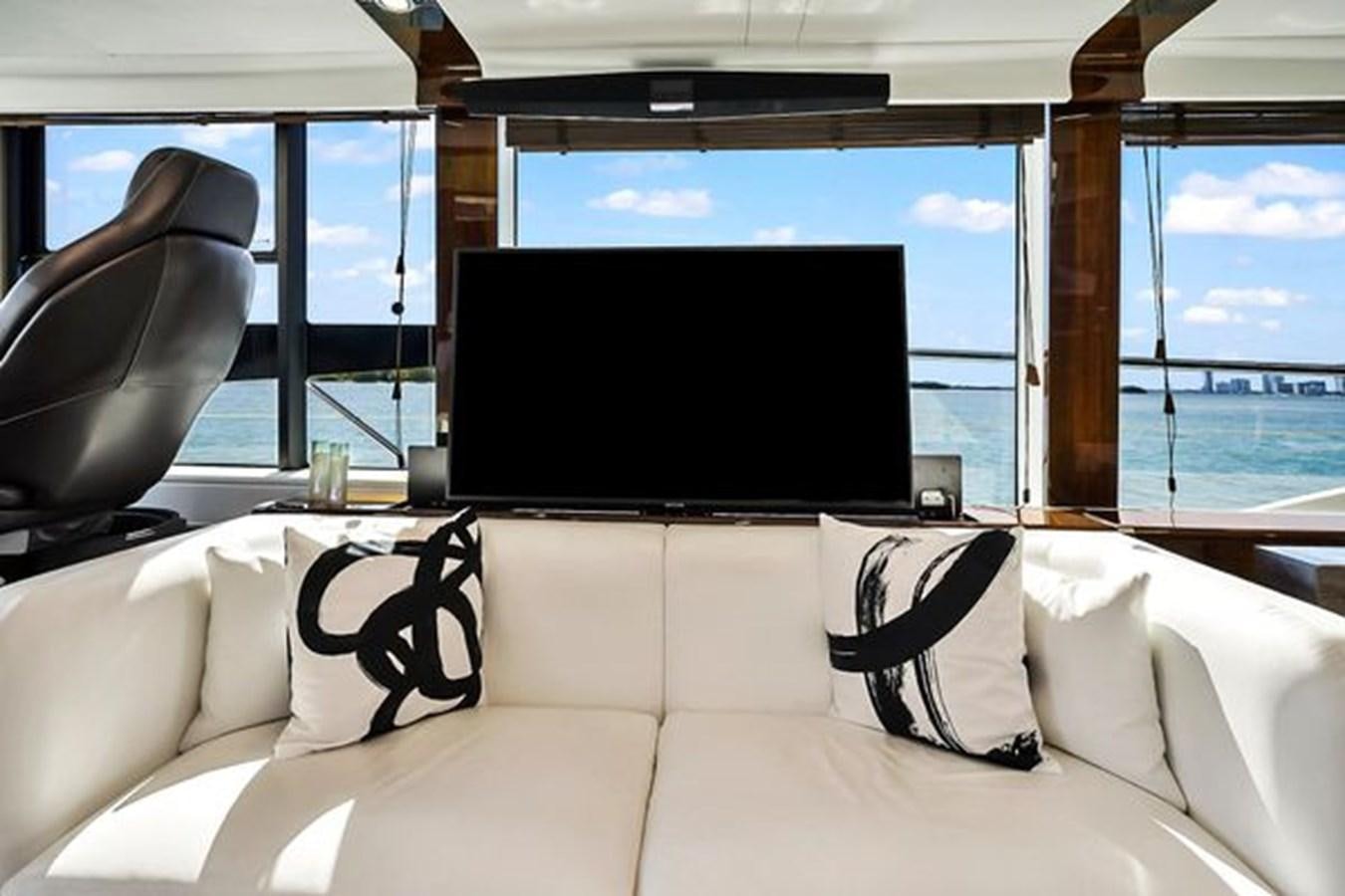 a large television in a room aboard 2021 FAIRLINE SQUADRON 68 Yacht for Sale