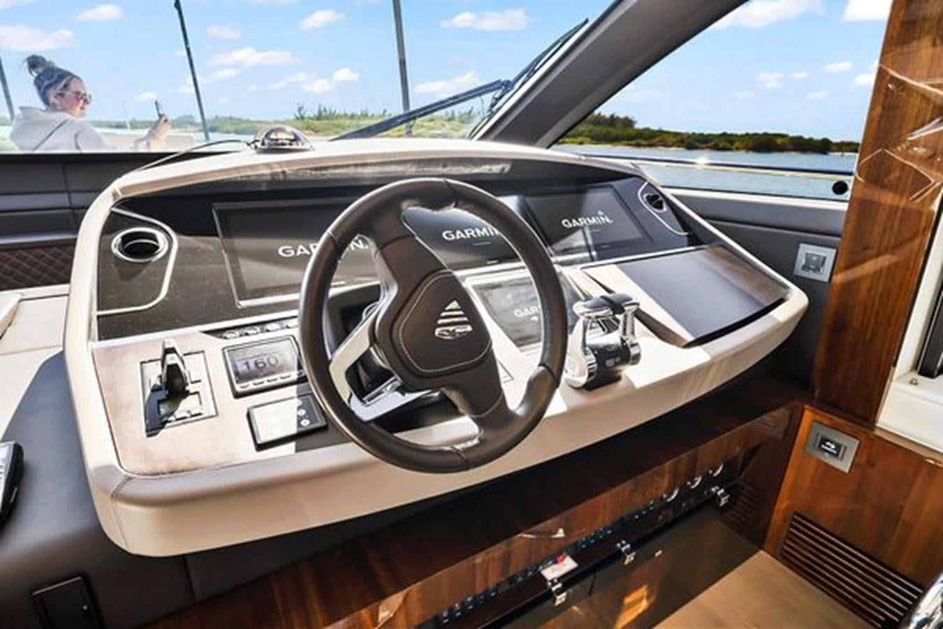 the inside of a car aboard 2021 FAIRLINE SQUADRON 68 Yacht for Sale