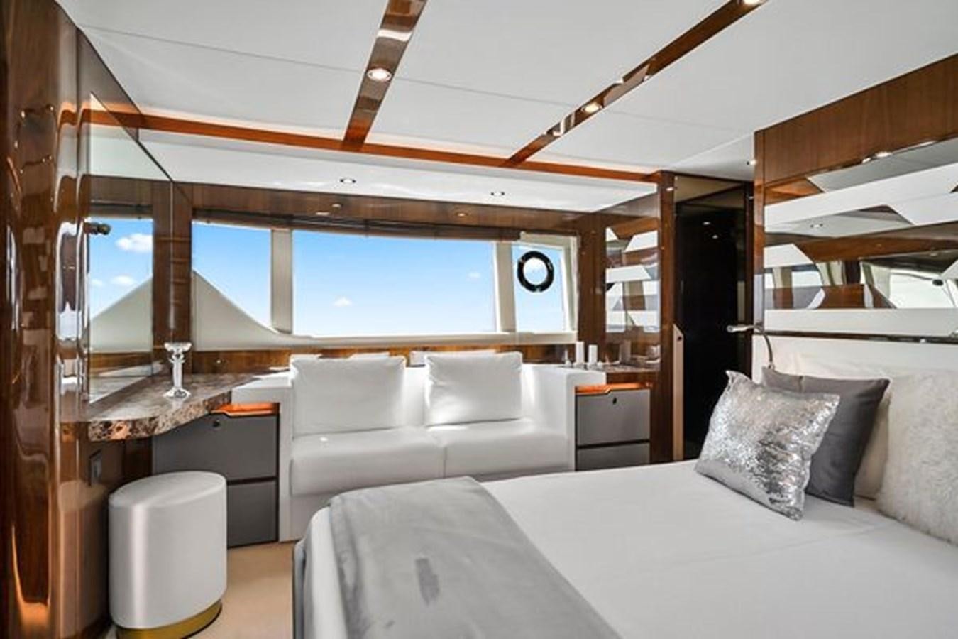 a room with a bed and a window aboard 2021 FAIRLINE SQUADRON 68 Yacht for Sale
