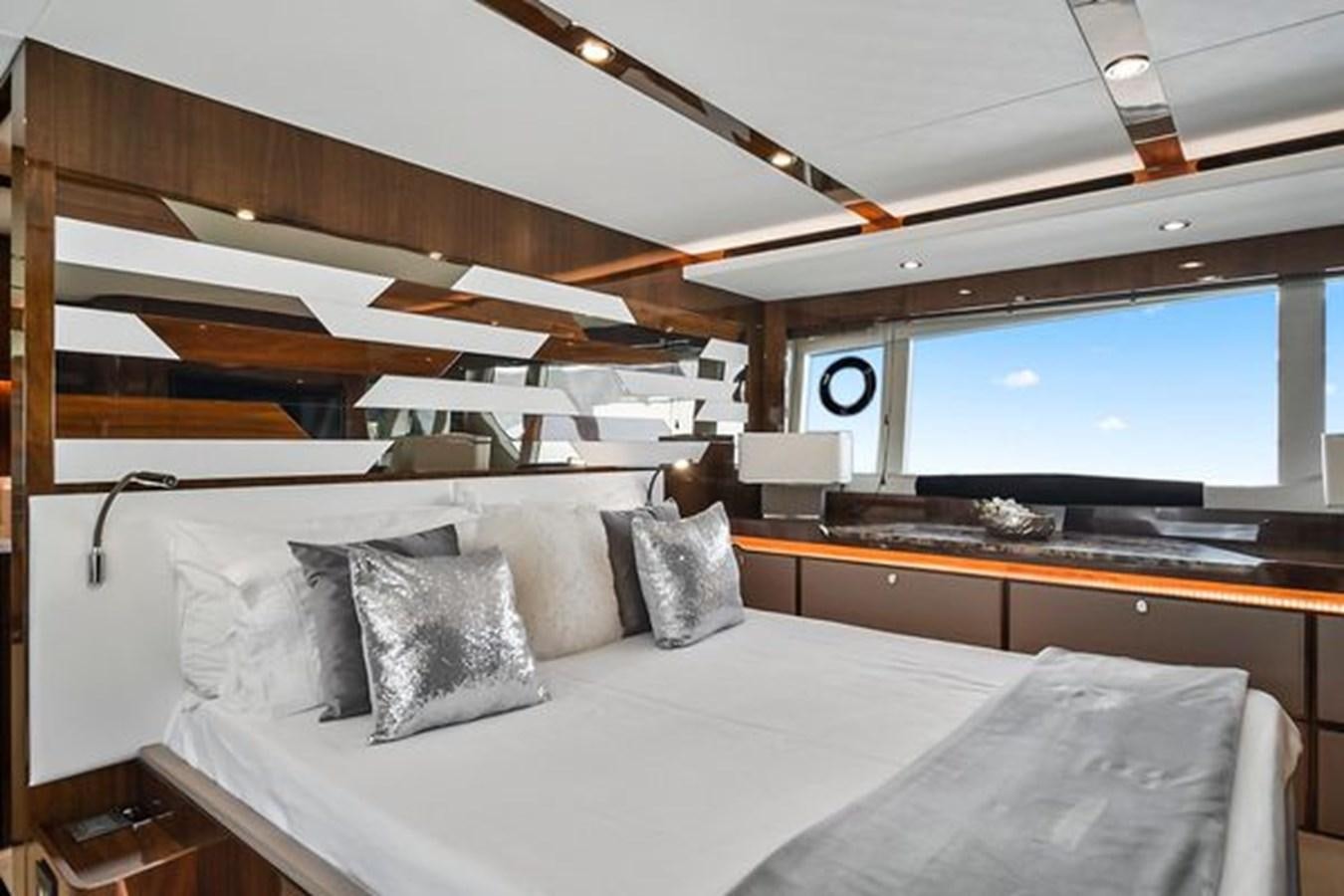 a room with a bed and a large window aboard 2021 FAIRLINE SQUADRON 68 Yacht for Sale