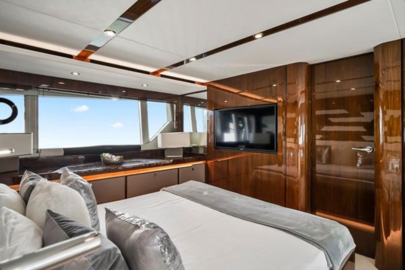 a room with a bed and a tv aboard 2021 FAIRLINE SQUADRON 68 Yacht for Sale