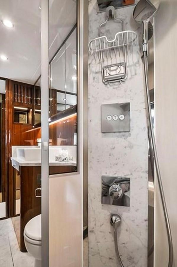 a bathroom with a glass shower aboard 2021 FAIRLINE SQUADRON 68 Yacht for Sale