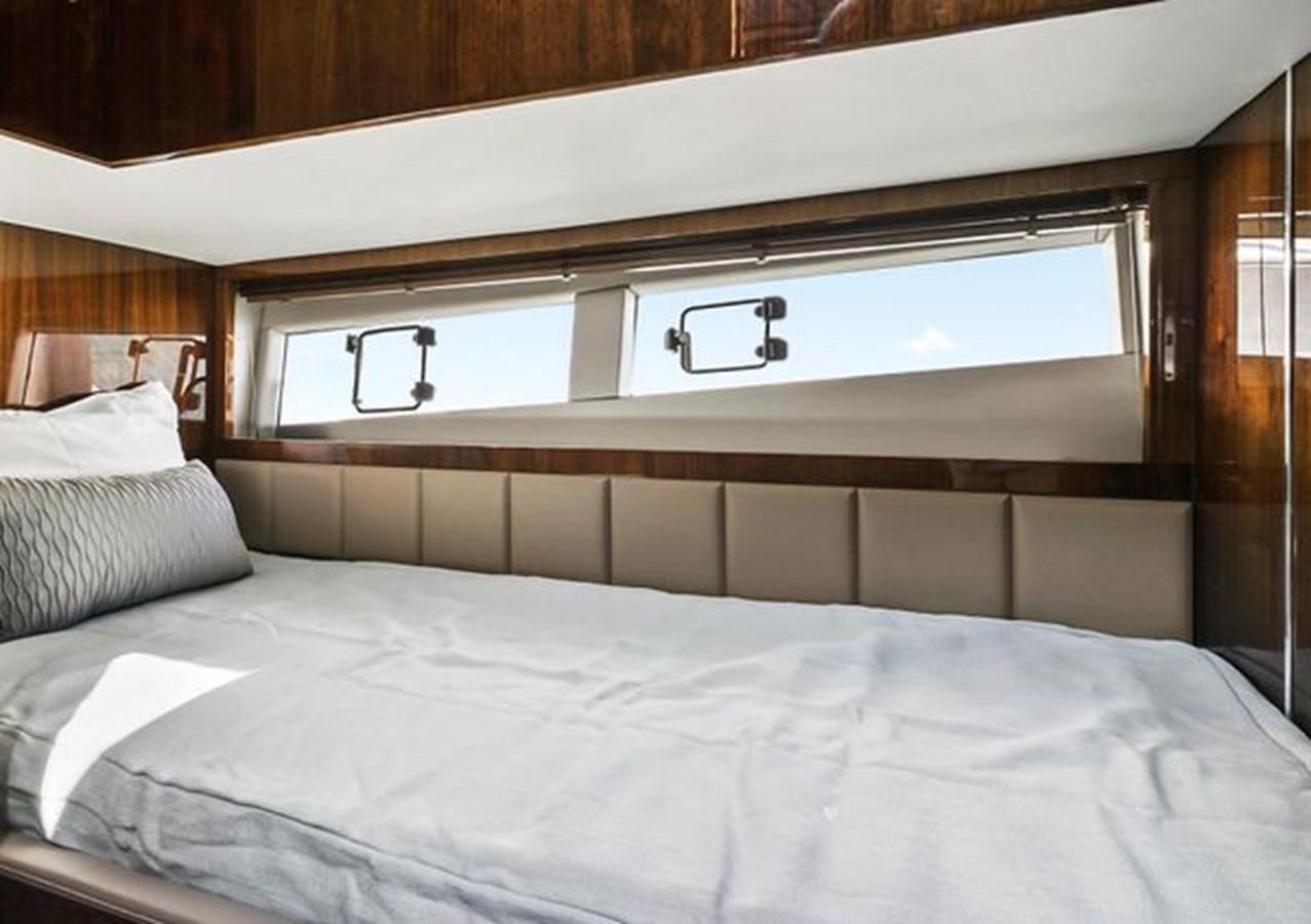 a bed with white sheets aboard 2021 FAIRLINE SQUADRON 68 Yacht for Sale