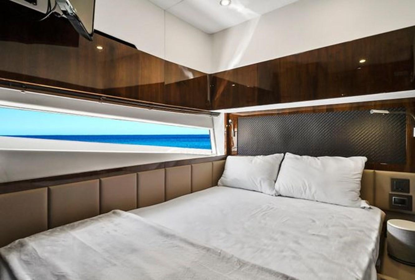 a bed with white sheets aboard 2021 FAIRLINE SQUADRON 68 Yacht for Sale