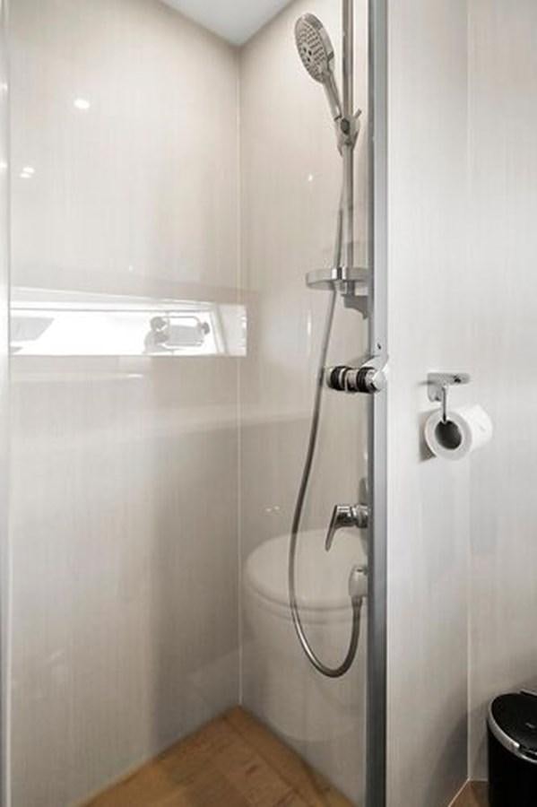 a shower with a glass door aboard 2021 FAIRLINE SQUADRON 68 Yacht for Sale