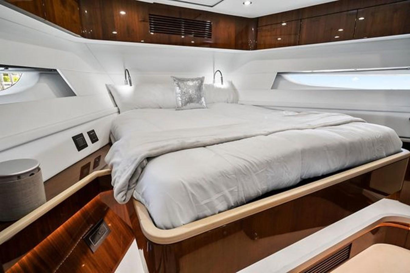 a bed with white sheets aboard 2021 FAIRLINE SQUADRON 68 Yacht for Sale