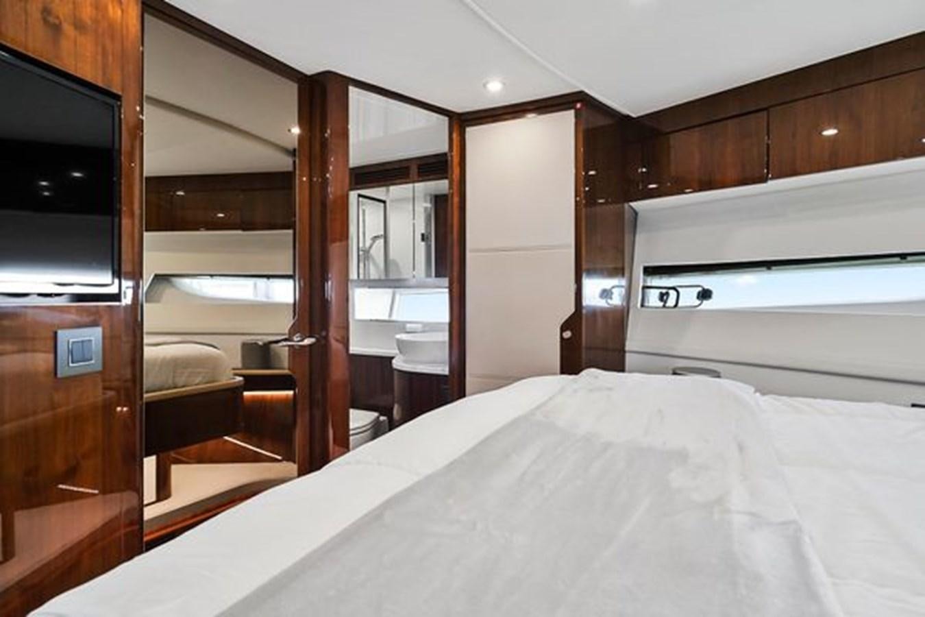 a bed in a room aboard 2021 FAIRLINE SQUADRON 68 Yacht for Sale