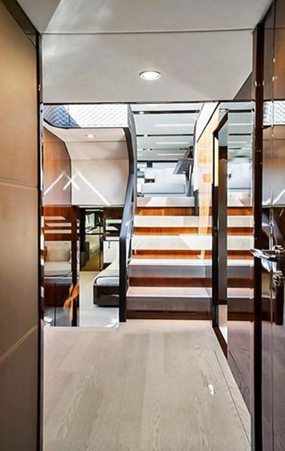 a hallway with a set of stairs aboard 2021 FAIRLINE SQUADRON 68 Yacht for Sale