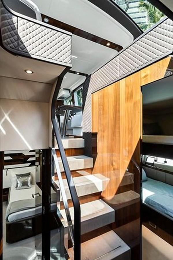 a staircase with a metal railing aboard 2021 FAIRLINE SQUADRON 68 Yacht for Sale