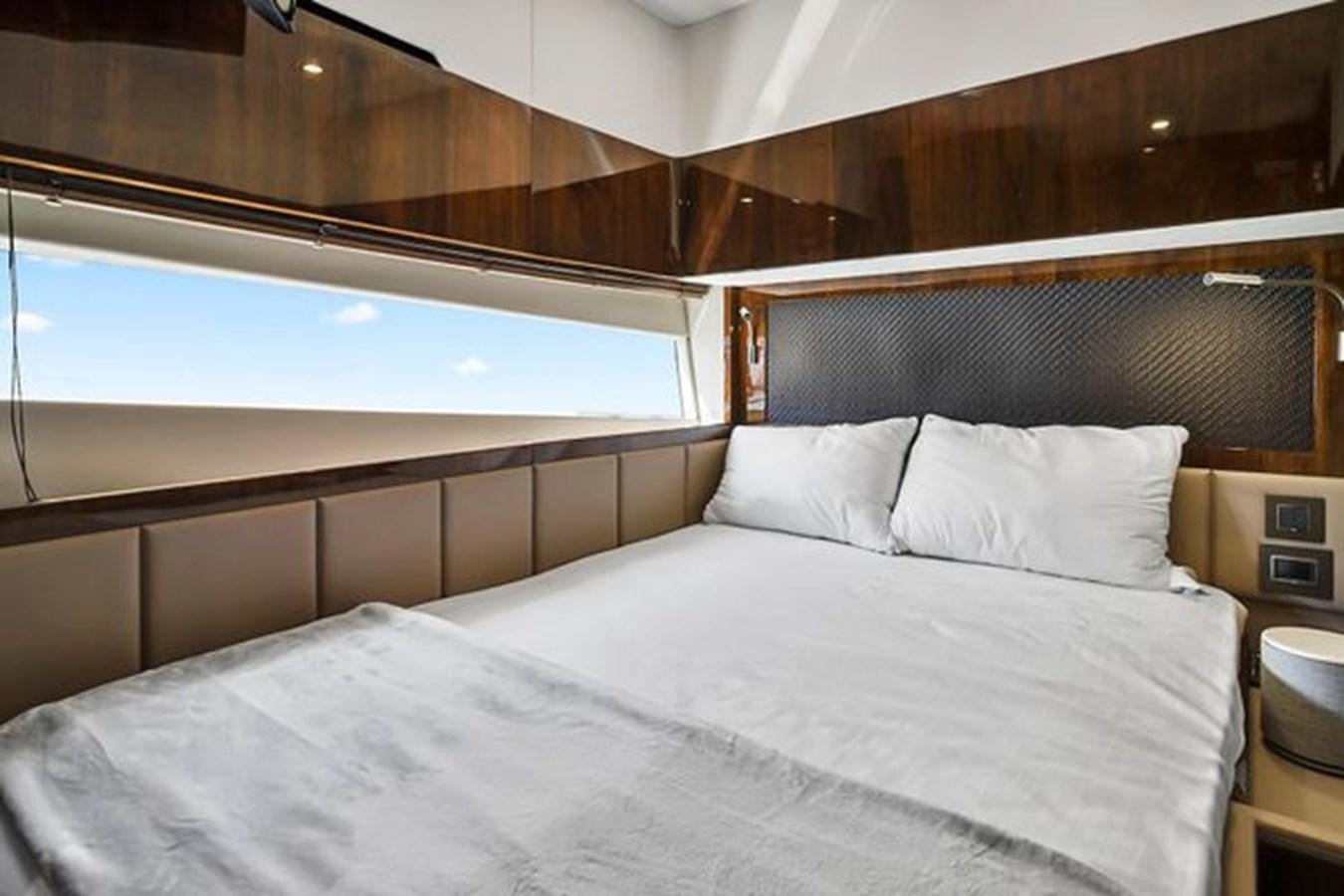 a bed with white sheets aboard 2021 FAIRLINE SQUADRON 68 Yacht for Sale