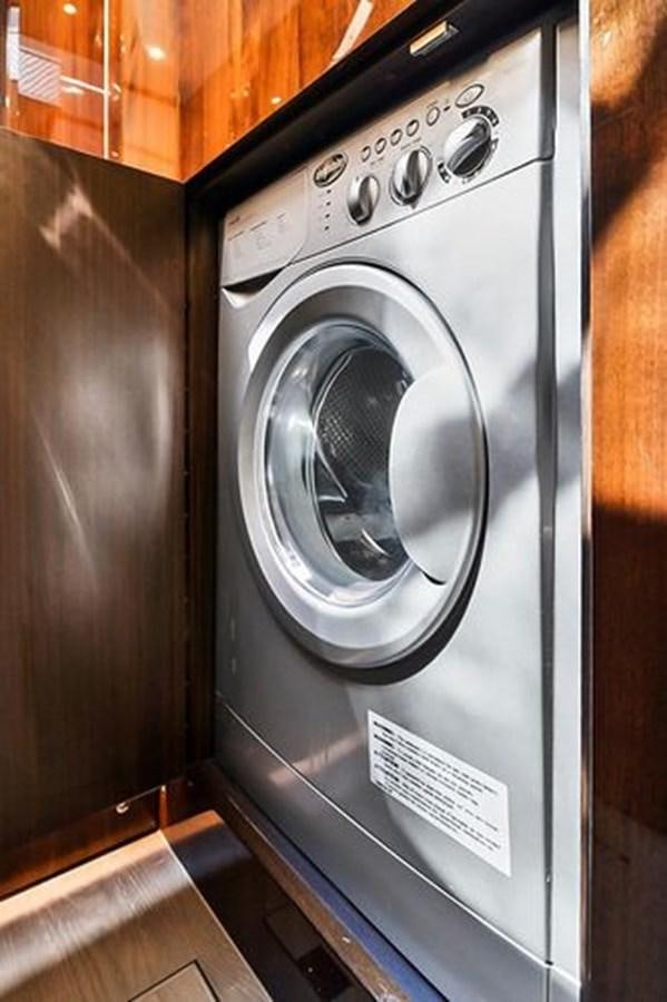 a black and silver washing machine aboard 2021 FAIRLINE SQUADRON 68 Yacht for Sale