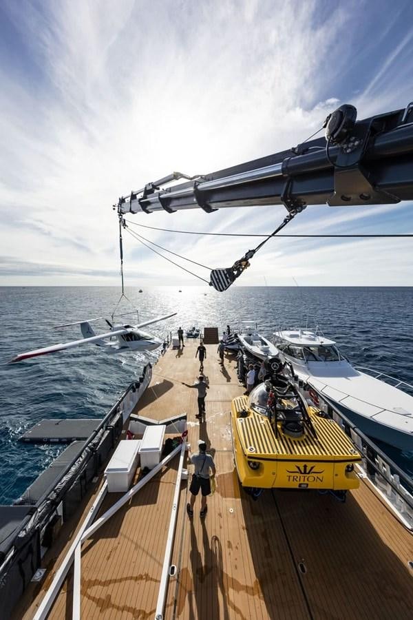 a large ship docked at a port aboard AXIS Yacht for Sale