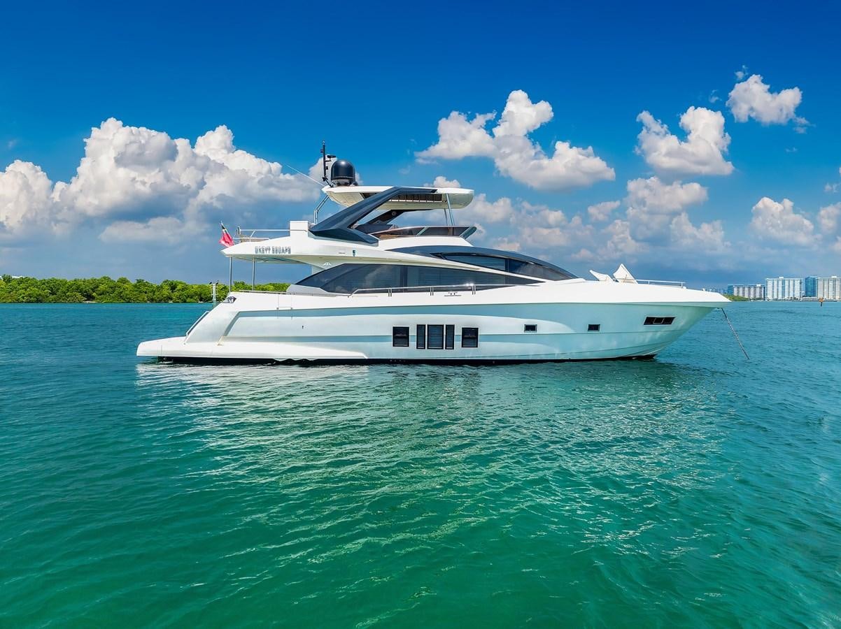 a white yacht in the water aboard GREYT ESCAPE Yacht for Sale