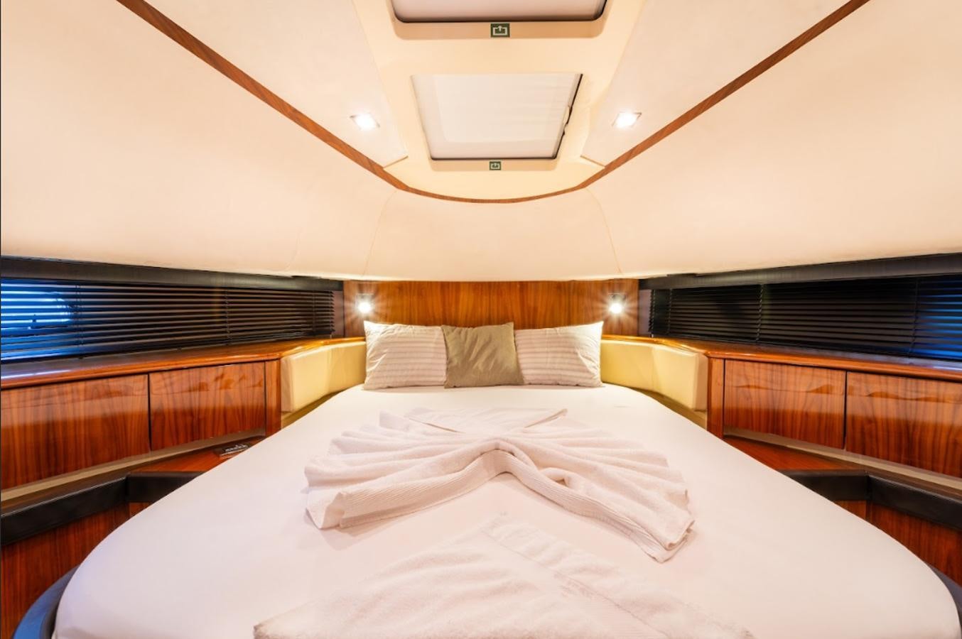 a room with a bed and a window aboard FAIRLINE SQUADRON 70 - 2010 Yacht for Sale