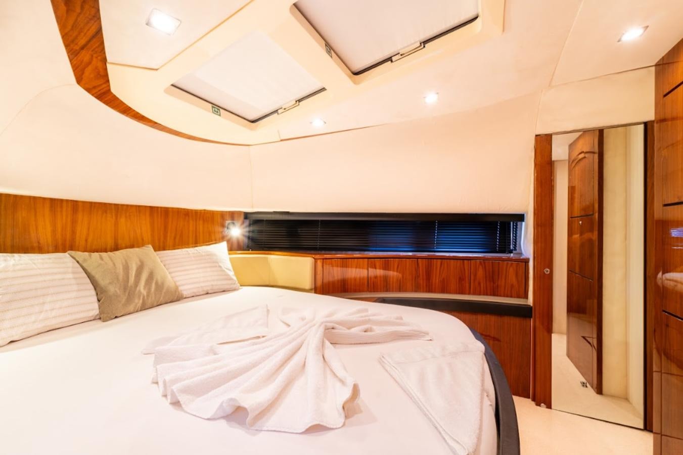 a room with a bed and a closet aboard FAIRLINE SQUADRON 70 - 2010 Yacht for Sale