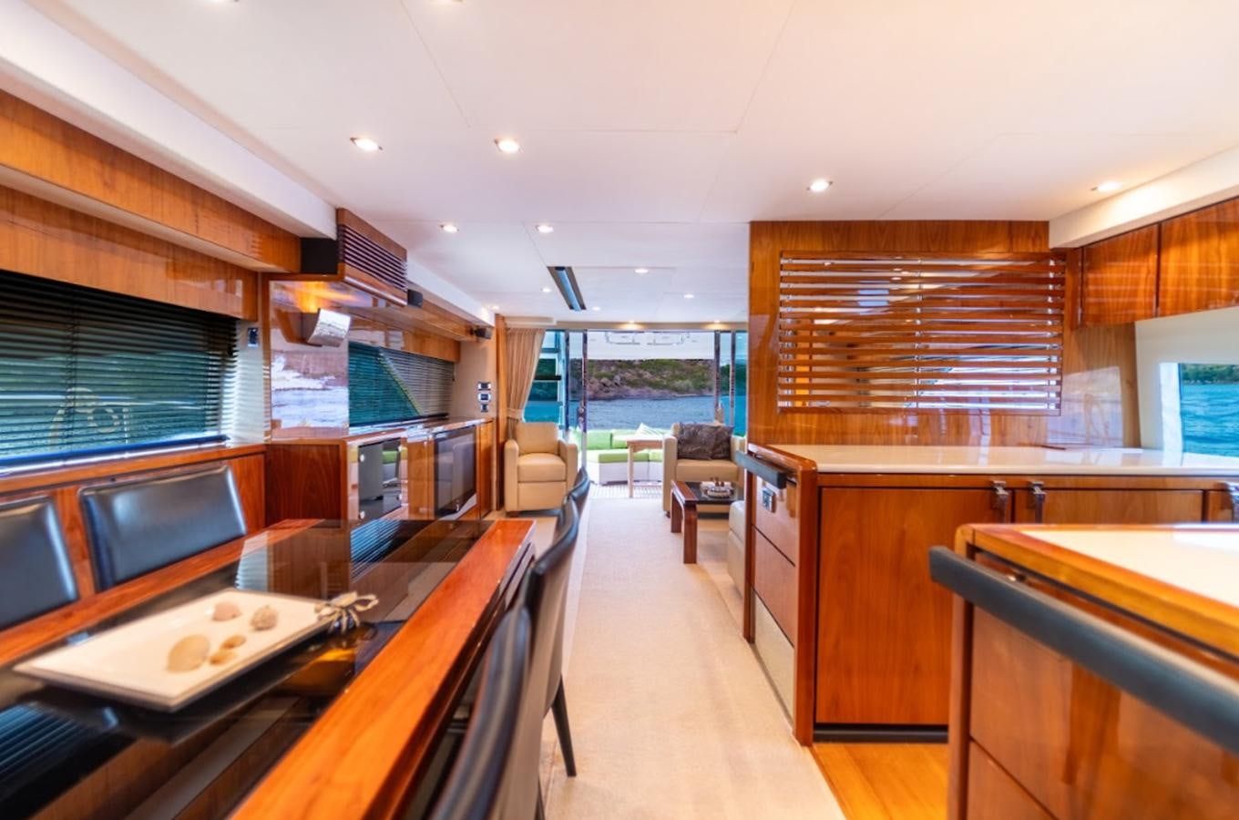 inside of a building with a large window and wood cabinets aboard FAIRLINE SQUADRON 70 - 2010 Yacht for Sale