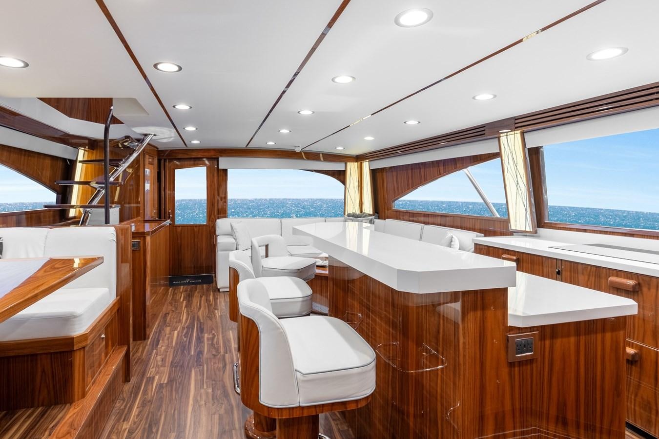 a room with a view of the ocean and the deck aboard TEAM HARVEY Yacht for Sale