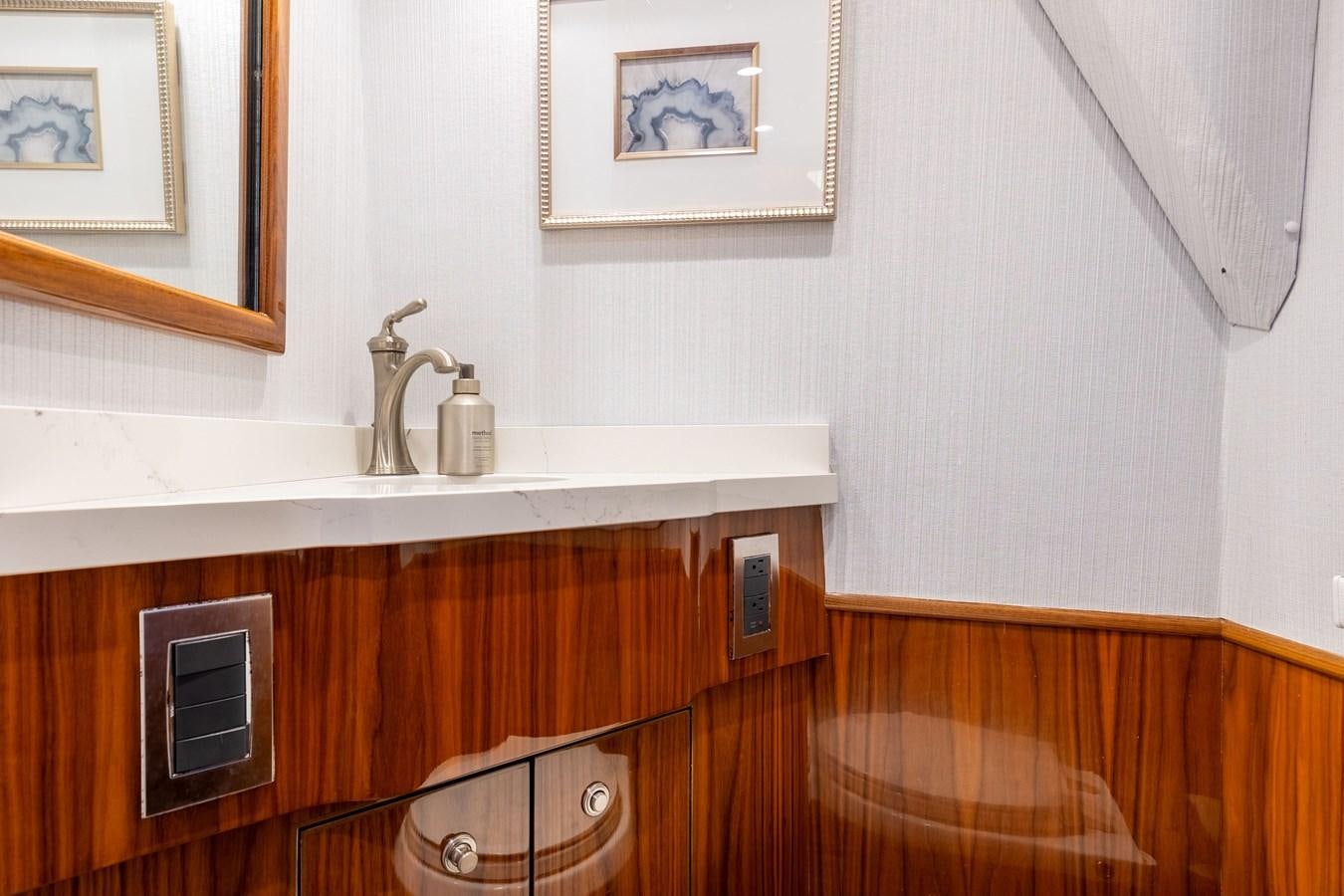 a sink and a mirror in a room aboard TEAM HARVEY Yacht for Sale