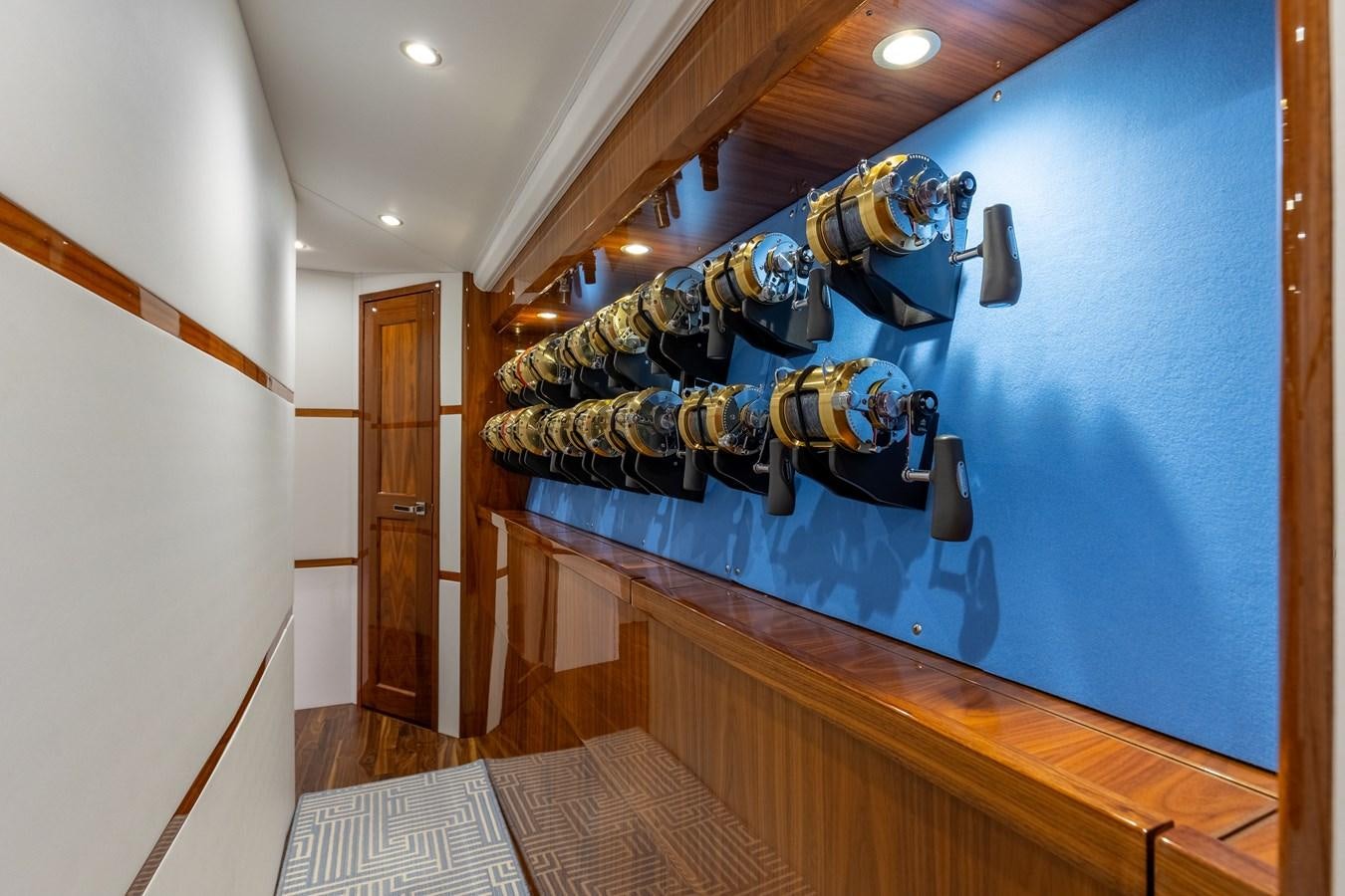 a room with a blue wall aboard TEAM HARVEY Yacht for Sale