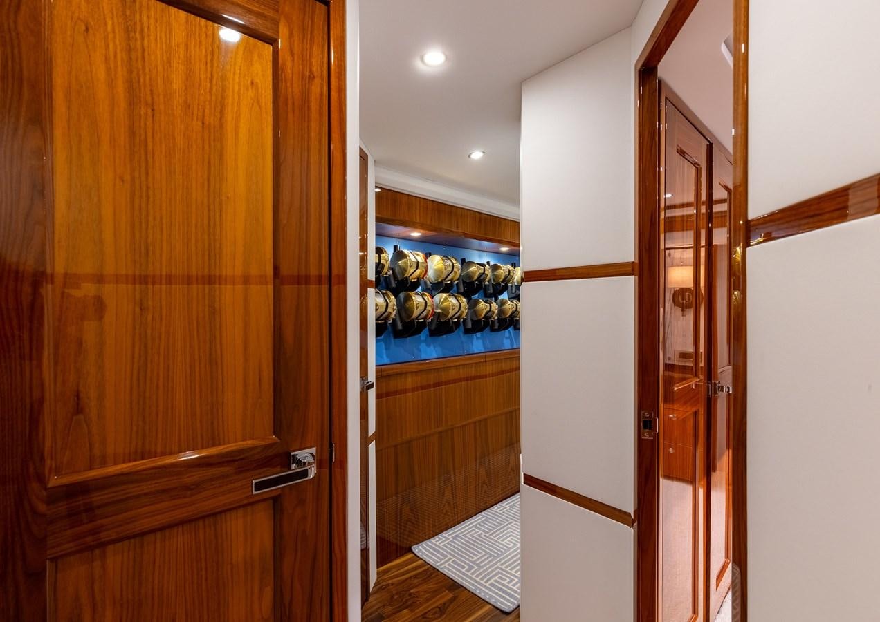 a room with a door and a mirror aboard TEAM HARVEY Yacht for Sale