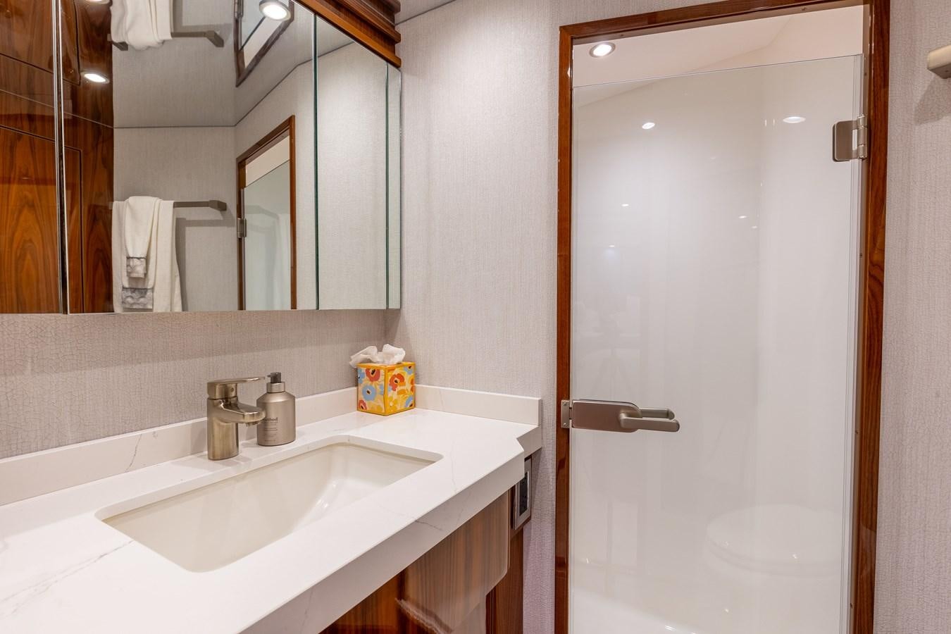 a bathroom with a sink and a mirror aboard TEAM HARVEY Yacht for Sale