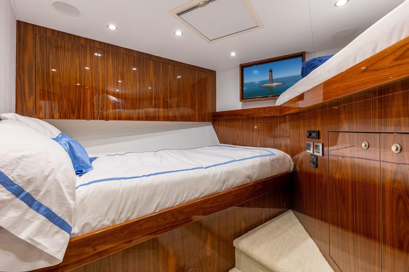 a room with a bed and a television aboard TEAM HARVEY Yacht for Sale