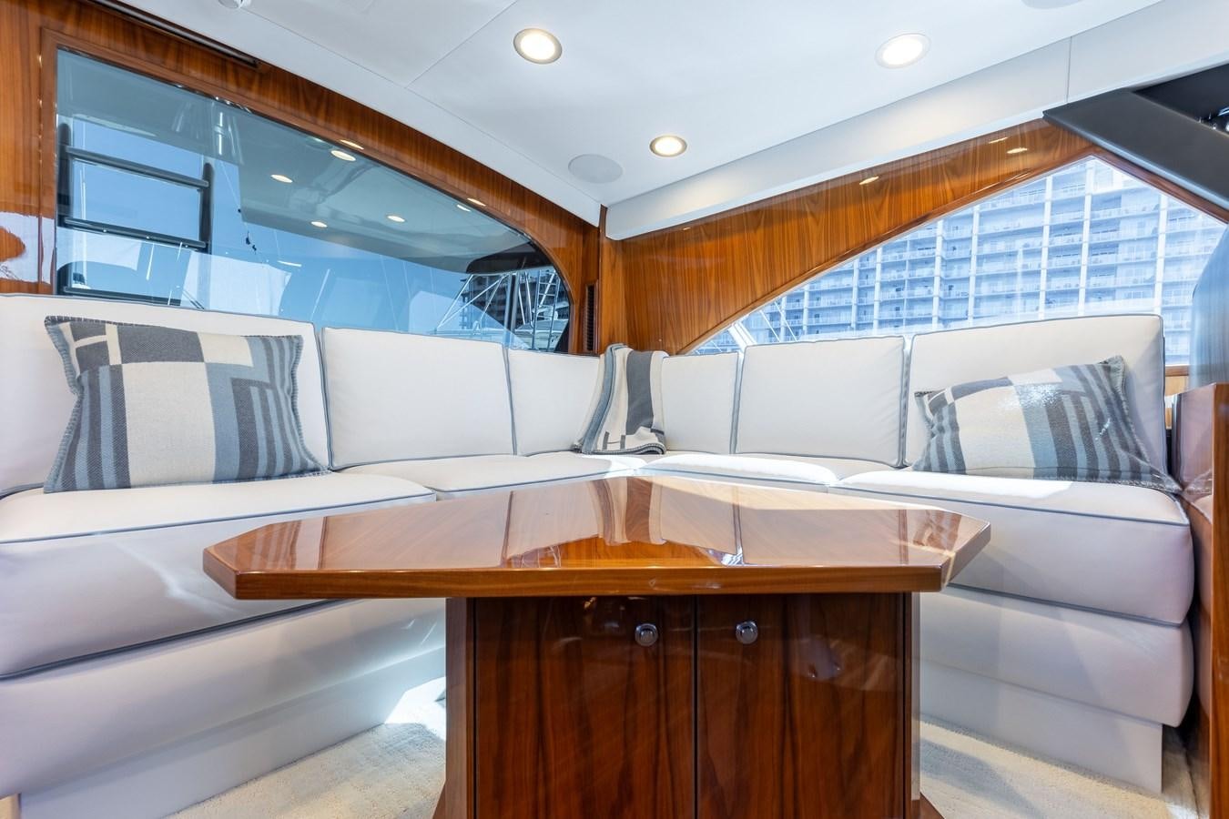 a room with a couch and a table aboard TEAM HARVEY Yacht for Sale