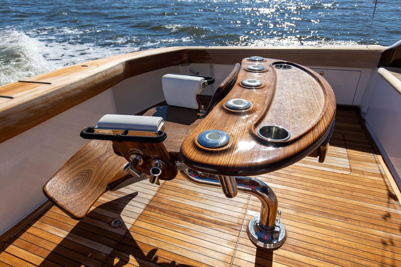 a wooden steering wheel on a boat aboard TEAM HARVEY Yacht for Sale
