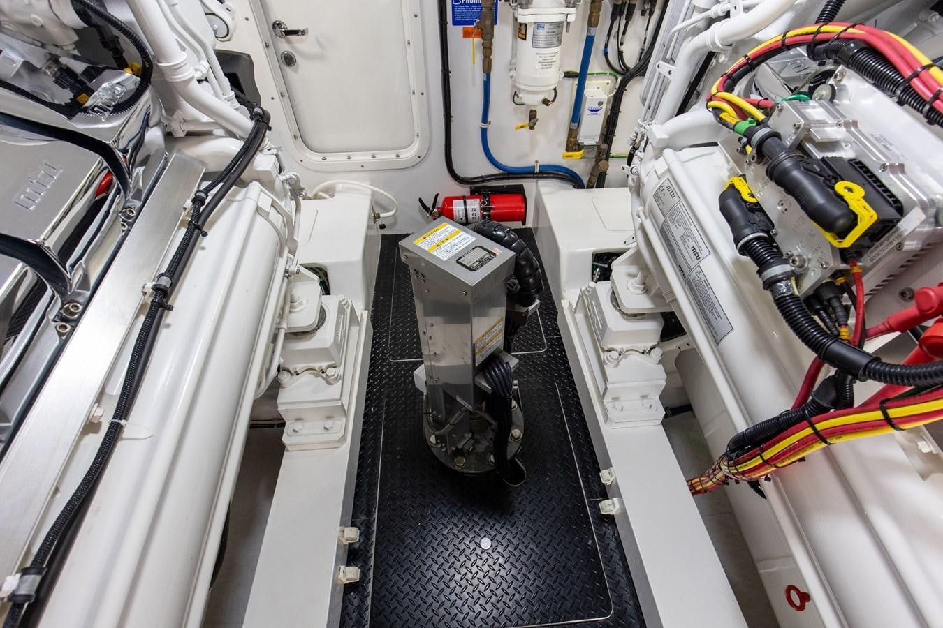 a close-up of a car engine aboard TEAM HARVEY Yacht for Sale