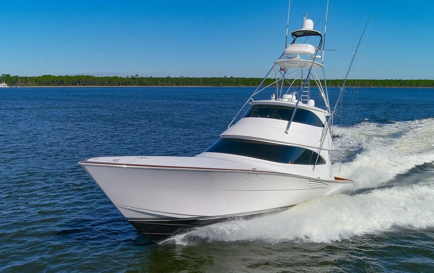 a white boat on water aboard TEAM HARVEY Yacht for Sale