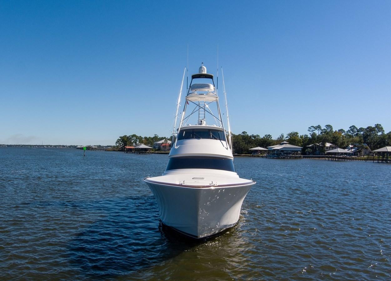 a white boat in the water aboard TEAM HARVEY Yacht for Sale