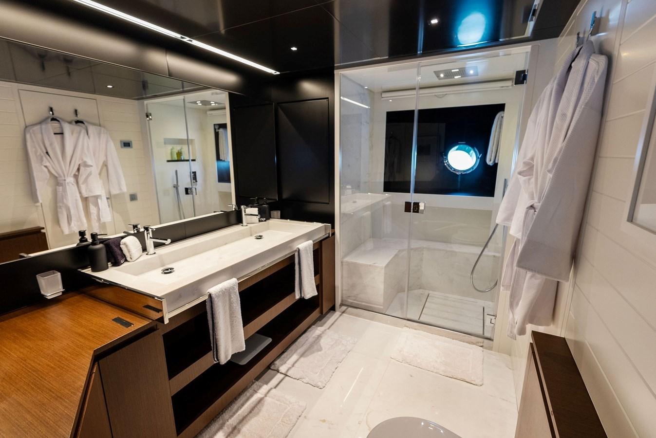 a bathroom with a large mirror aboard HEAVEN Yacht for Sale