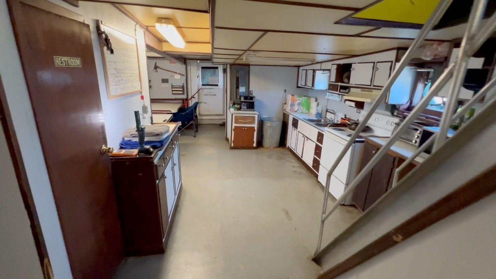 a room with a desk and computer aboard COMMERCIAL Yacht for Sale