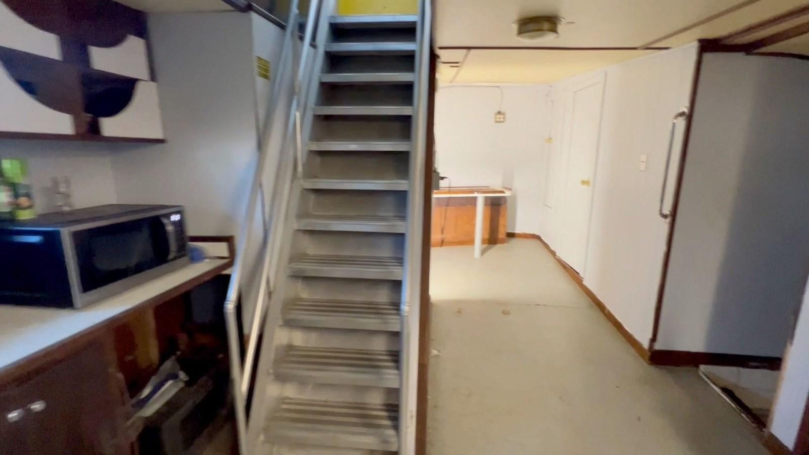 a ladder in a room aboard COMMERCIAL Yacht for Sale
