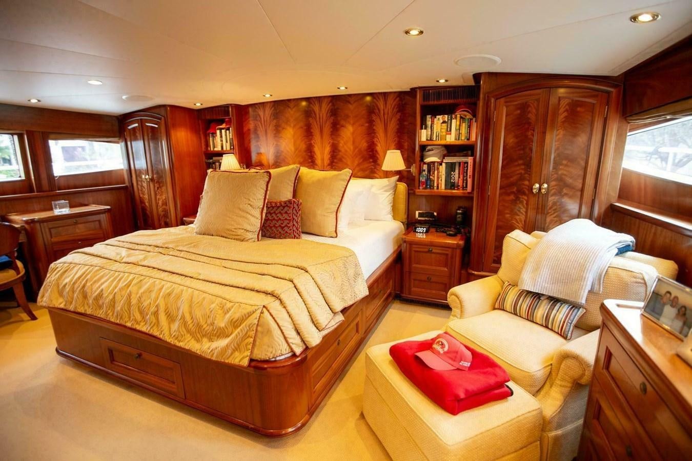 a bedroom with a bed and a couch aboard WATERFORD Yacht for Sale