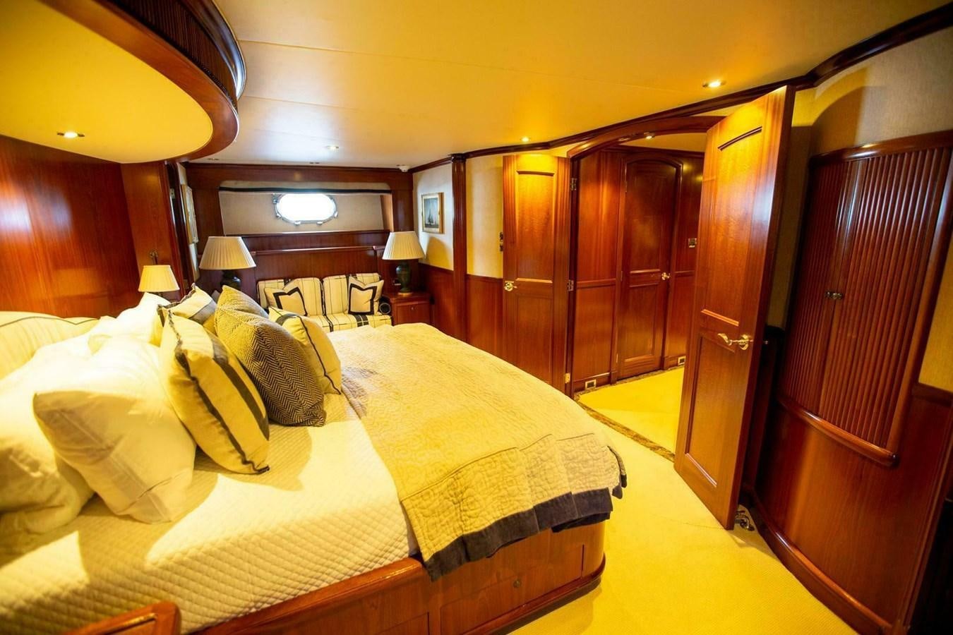 a room with a bed and a closet aboard WATERFORD Yacht for Sale