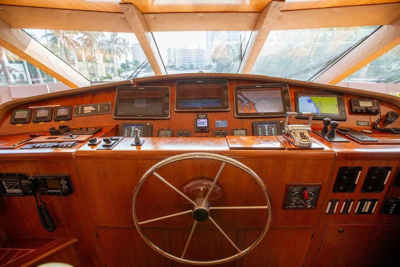 a wooden paneled vehicle with a large round window aboard WATERFORD Yacht for Sale