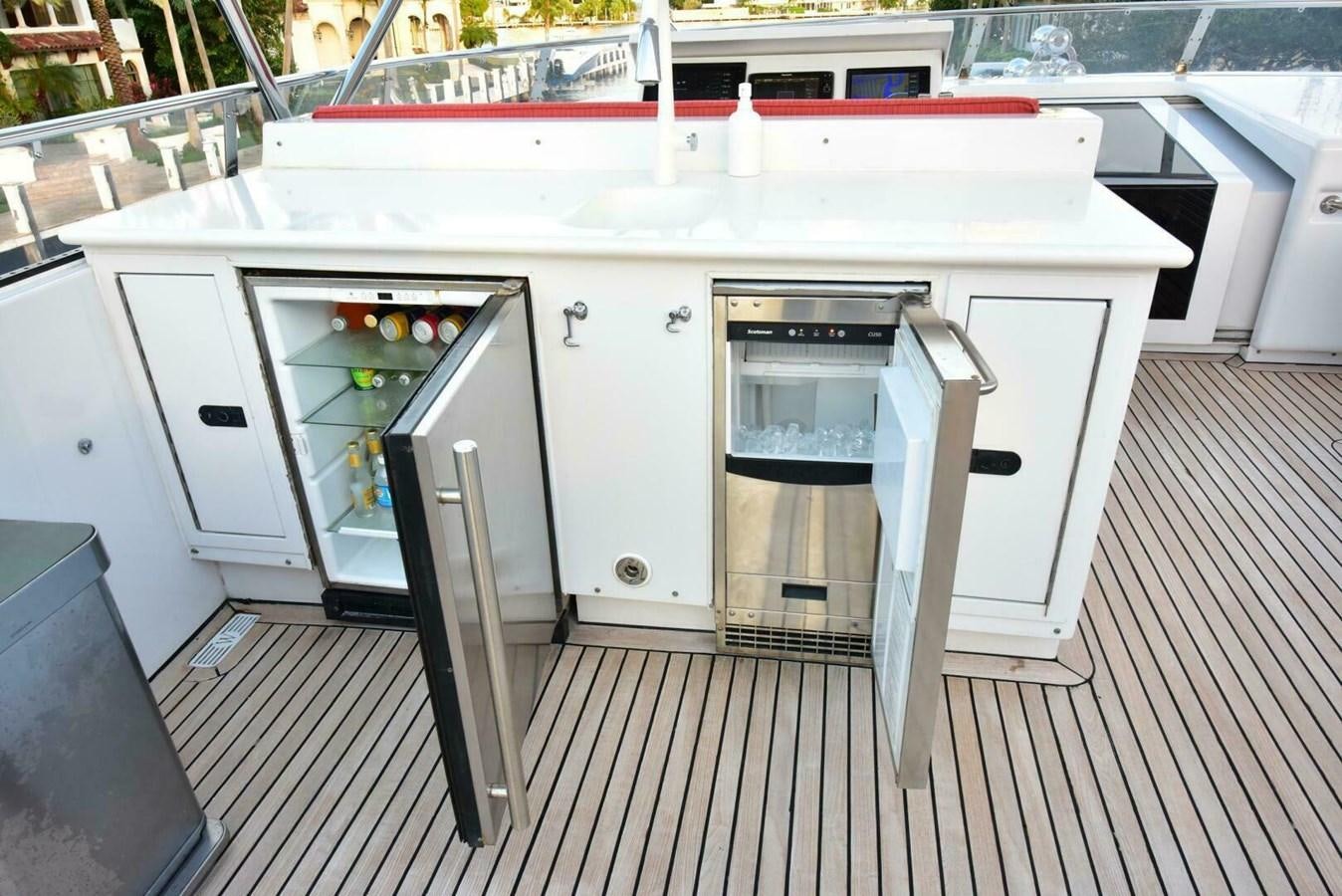 a kitchen with white cabinets aboard WATERFORD Yacht for Sale