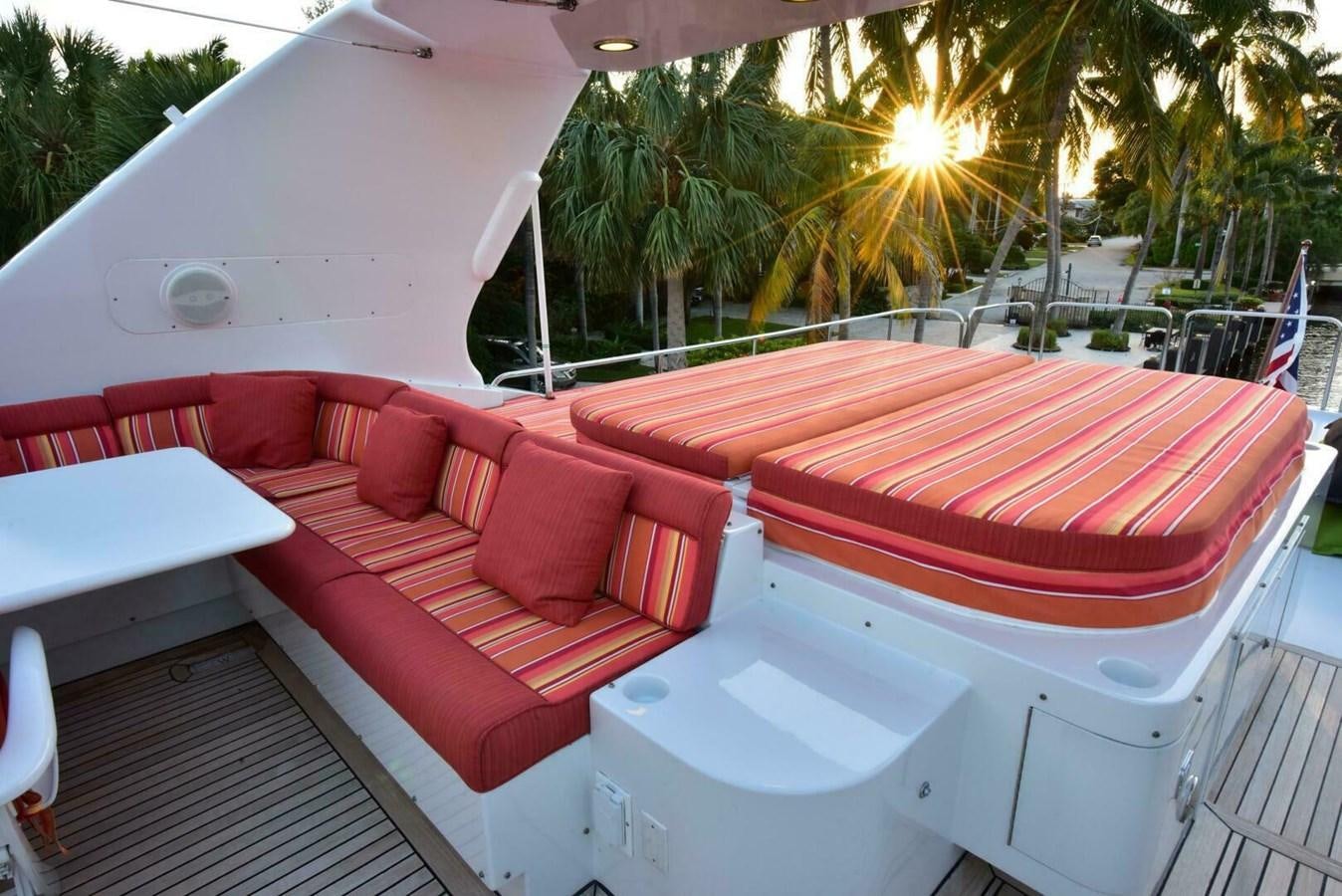 a lounge area with a lounge chair and a large white tent aboard WATERFORD Yacht for Sale