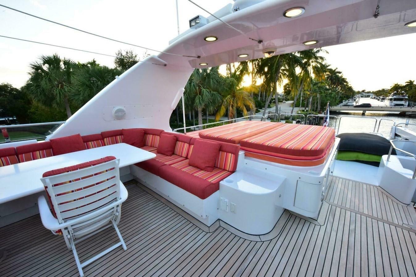 a lounge area with a lounge chair and a pool aboard WATERFORD Yacht for Sale