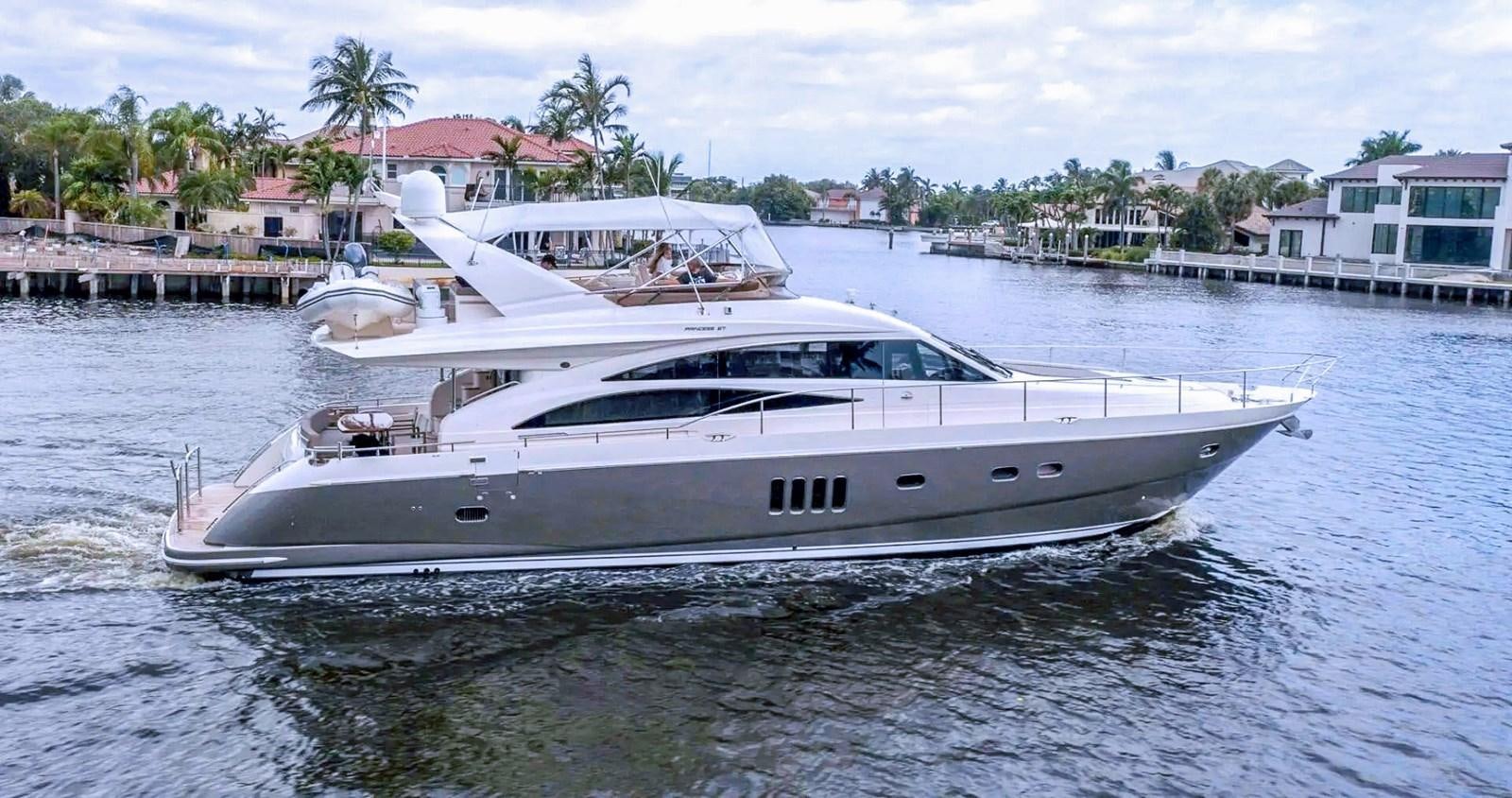 a white yacht in the water aboard TRINITY Yacht for Sale