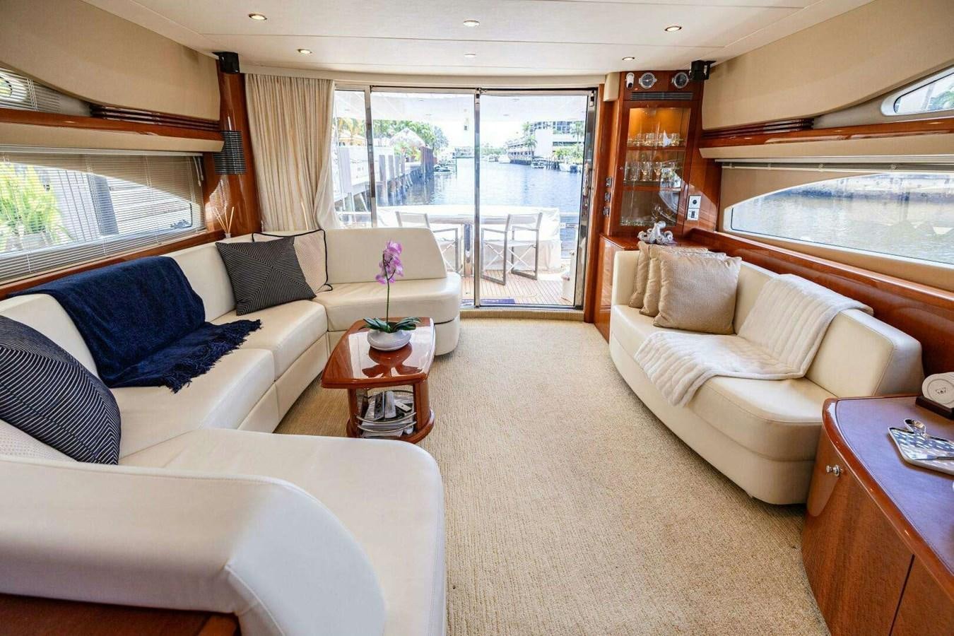 a living room with a large window aboard TRINITY Yacht for Sale