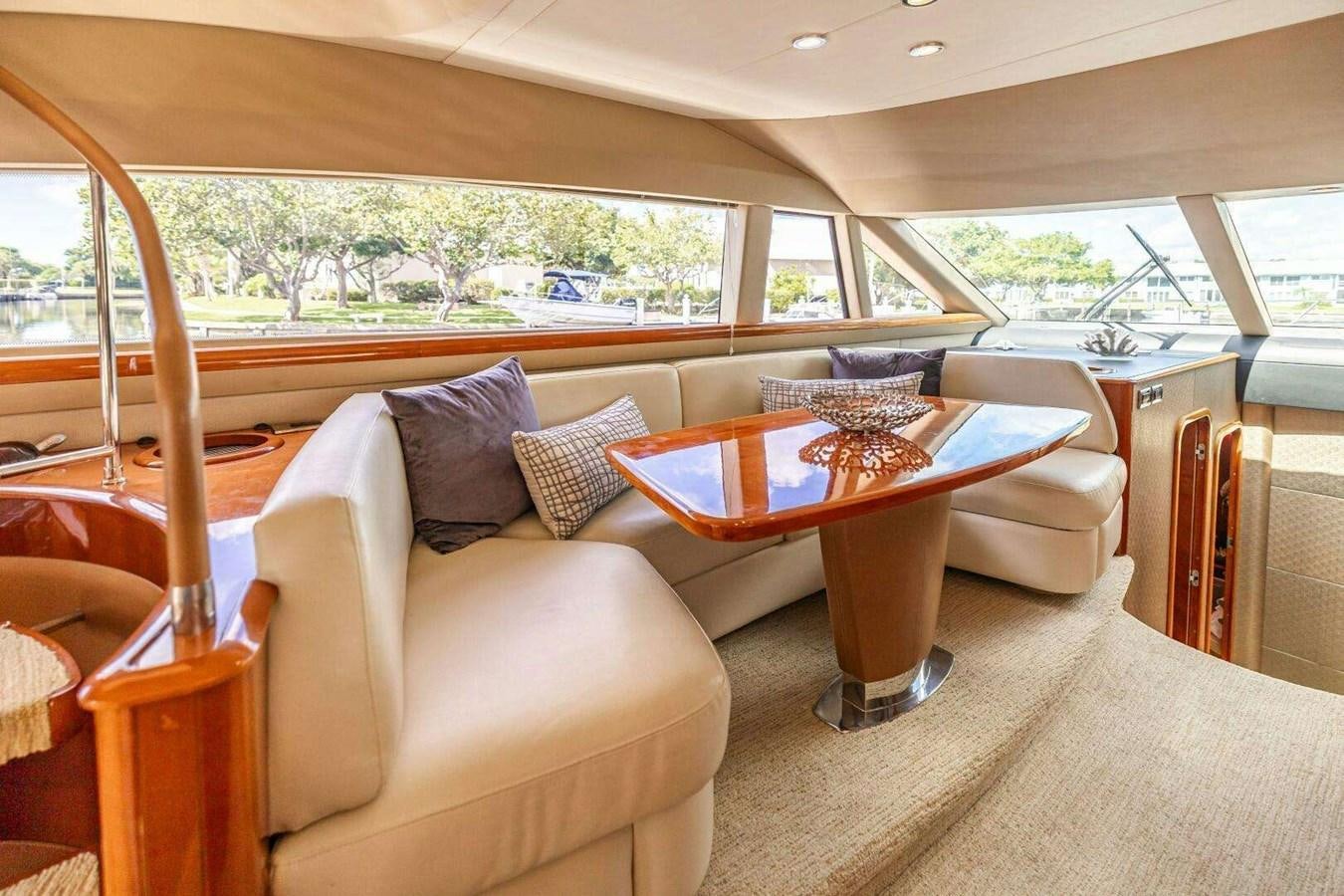 a living room with a table and chairs aboard TRINITY Yacht for Sale
