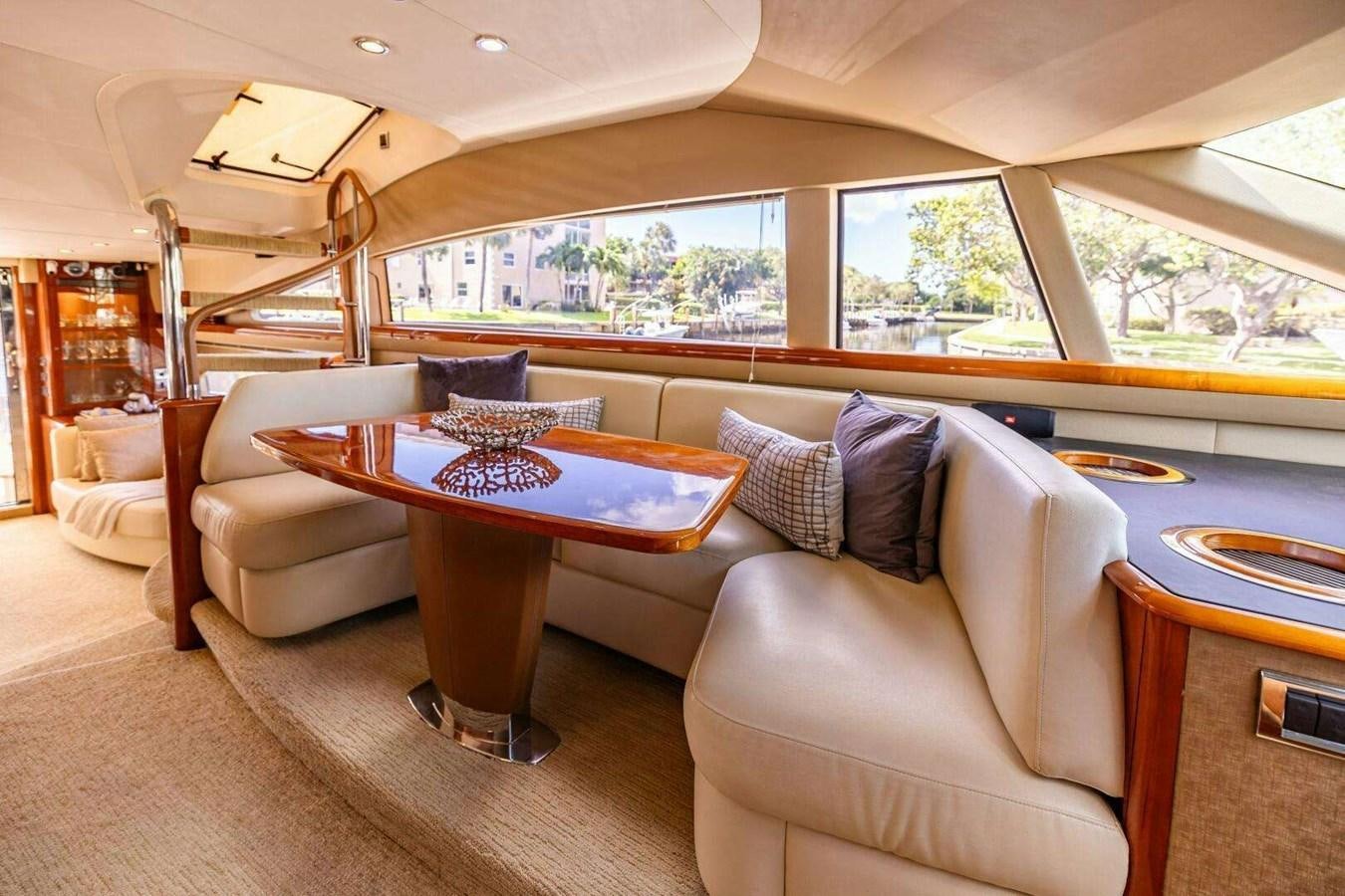 a living room with a large window aboard TRINITY Yacht for Sale