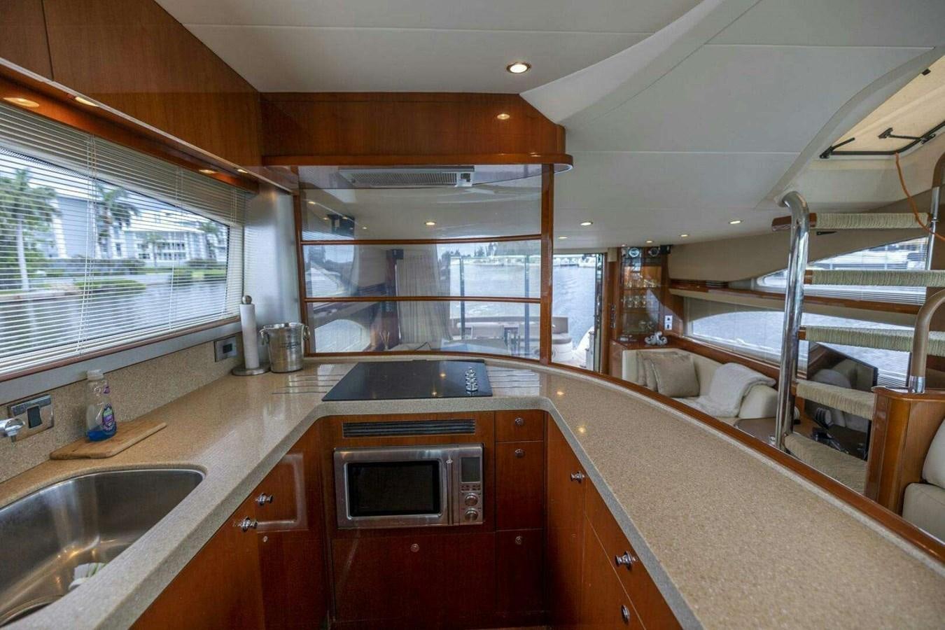 a kitchen with a sink and a bunk bed aboard TRINITY Yacht for Sale