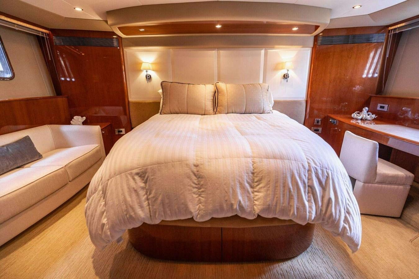 a bed with a white bed aboard TRINITY Yacht for Sale