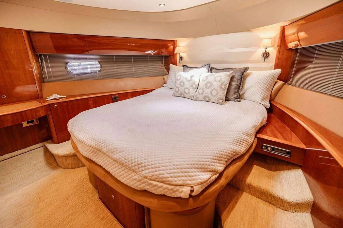 a bed with white sheets aboard TRINITY Yacht for Sale