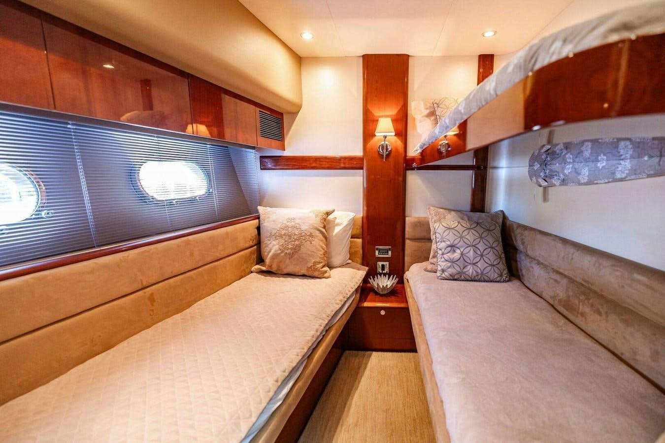 a room with a bed and a couch aboard TRINITY Yacht for Sale